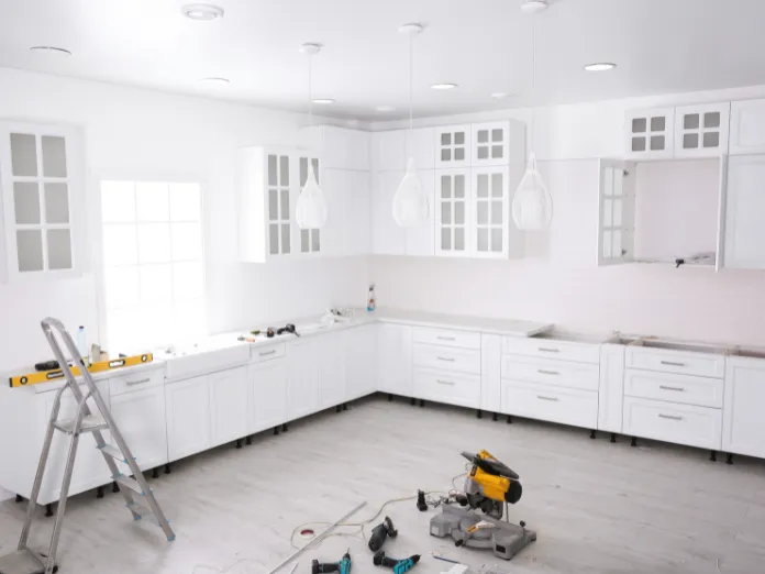 Custom kitchen cabinets installation in Dallas featuring modern white cabinetry being professionally installed by Kitchen Pro Dallas