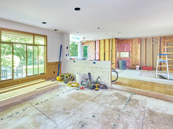 Professional kitchen remodeling in Dallas showing an open-concept kitchen renovation during construction with framing, tools, and structural reconfiguration by Kitchen Pro Dallas