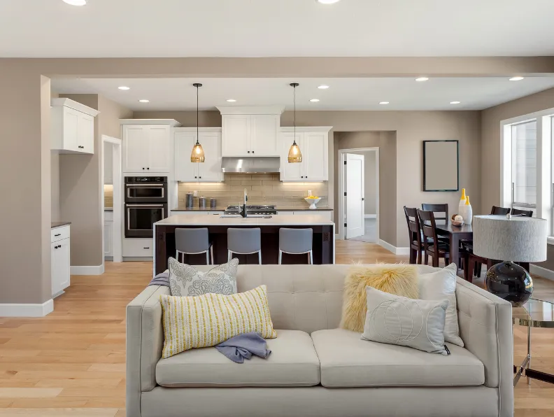 Open concept design and space reconfiguration connecting kitchen, dining, and living areas in Dallas TX